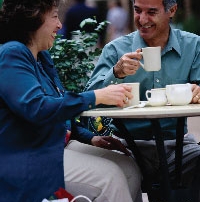 Couple dining at an outdoor cafe.