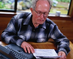 elderly man at computer